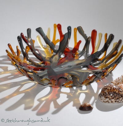 Hand crafted fused glass reflecting coral branches.
