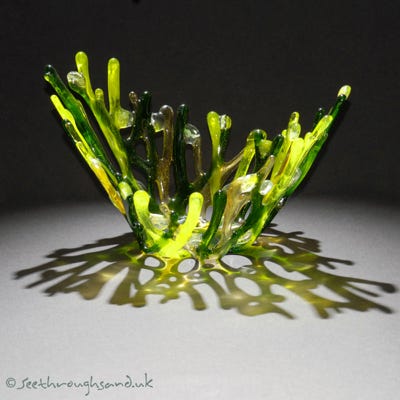 Hand crafted fused glass reflecting coral branches.